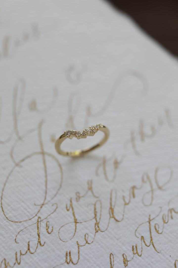 0.12 TCW Round Curved Diamond Wedding Band