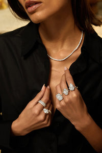 model wear approx 10 carat size lab grown diamond rings on her hand and wear tennis necklace