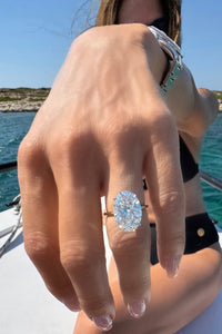 our customer proposal image with big oval lab grown diamond engagement rings on boat