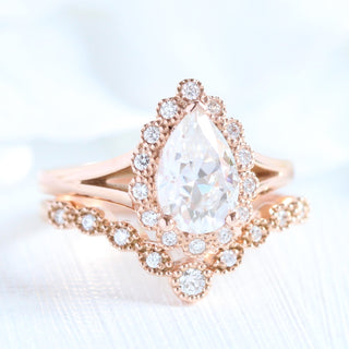 Pear Cut Moissanite Ring With Curve Halo Diamond Band